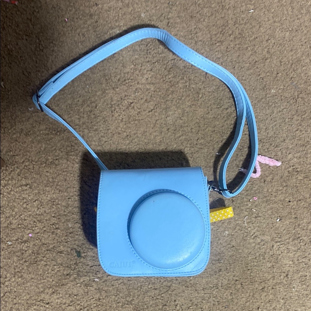 Light Blue Digital Camera Bag with Adjustable Strap and Compact Design